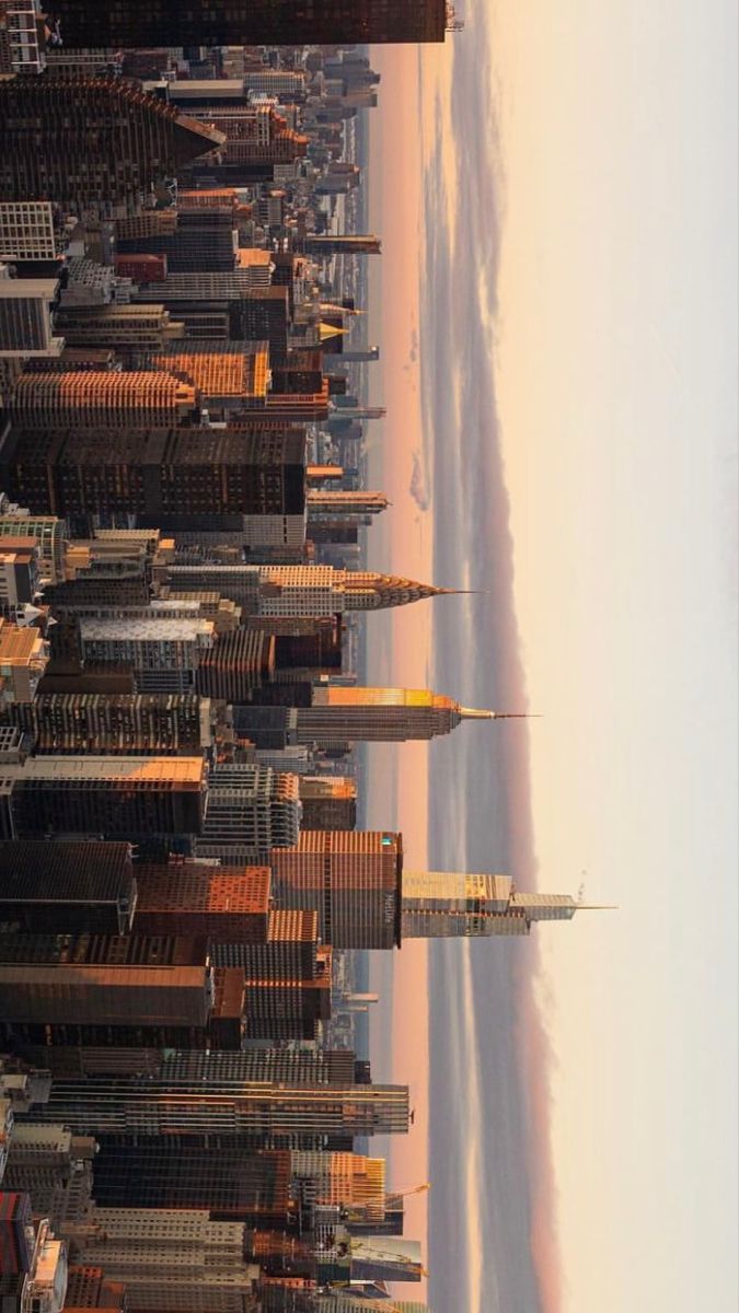 an aerial view of a city with tall buildings