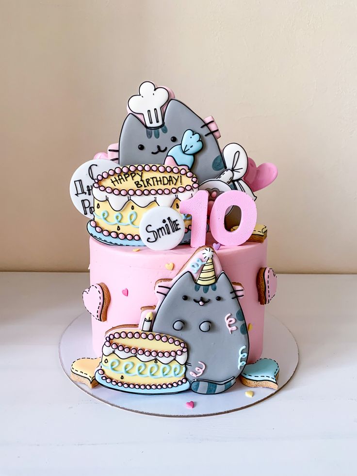 a birthday cake decorated with cartoon characters