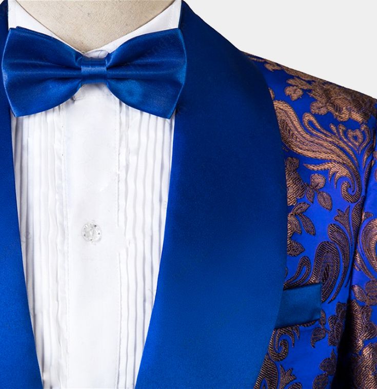 Turn some heads at your next formal event with this 3 pieces royal blue tuxedo. Take your formal wardrobe to the next level and indulge yourself with class, style, and sophistication when you add this tux to your collection. The royal blue hues gleam enticingly, while the golden embroidery gleams in a mischievous manner. The mix of blue and gold creates a mesmerizing effect that impresses right from the start. The pattern is a combination of floral and paisley motifs – the detailing is exquisite Royal Fitted Tuxedo For Formal Events, Royal Fitted Tuxedo For Formal Occasions, Elegant Tuxedo For Gala And Festive Occasions, Blue Tuxedo Three-piece Suit For Party, Elegant Festive Suits For Gala, Tailored Tuxedo Sets For Gala, Elegant Festive Gala Suits, Elegant Gala Suits For Festive Season, Elegant Gala Suits For Festive Occasions