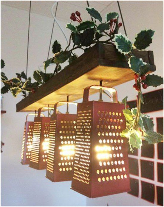 several lights hanging from a wooden beam with ivy growing on it and attached to the ceiling