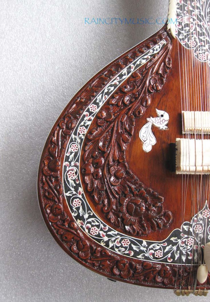 an intricately carved wooden instrument on display