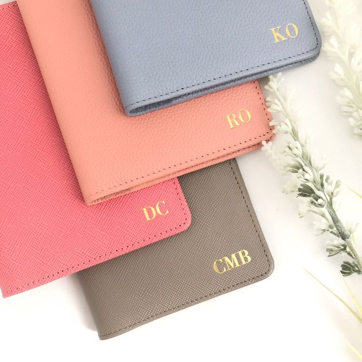 three different colored wallets sitting next to each other