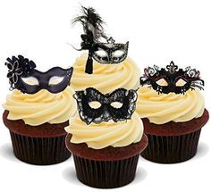 three cupcakes with masquerade masks on top