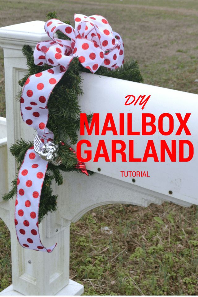 the mailbox garland is tied with a bow on it and sits in front of a sign that reads diy mailbox garland