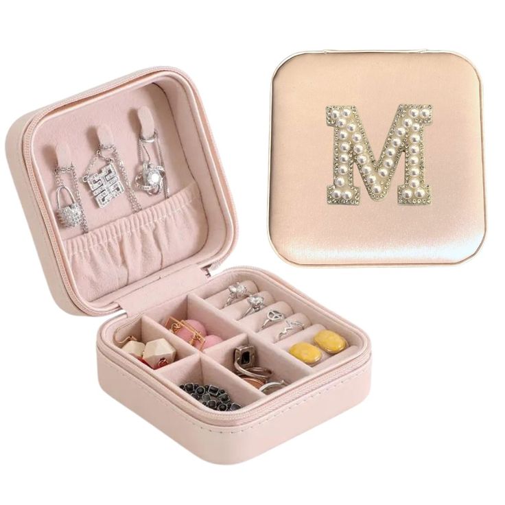 a small pink case filled with lots of jewelry