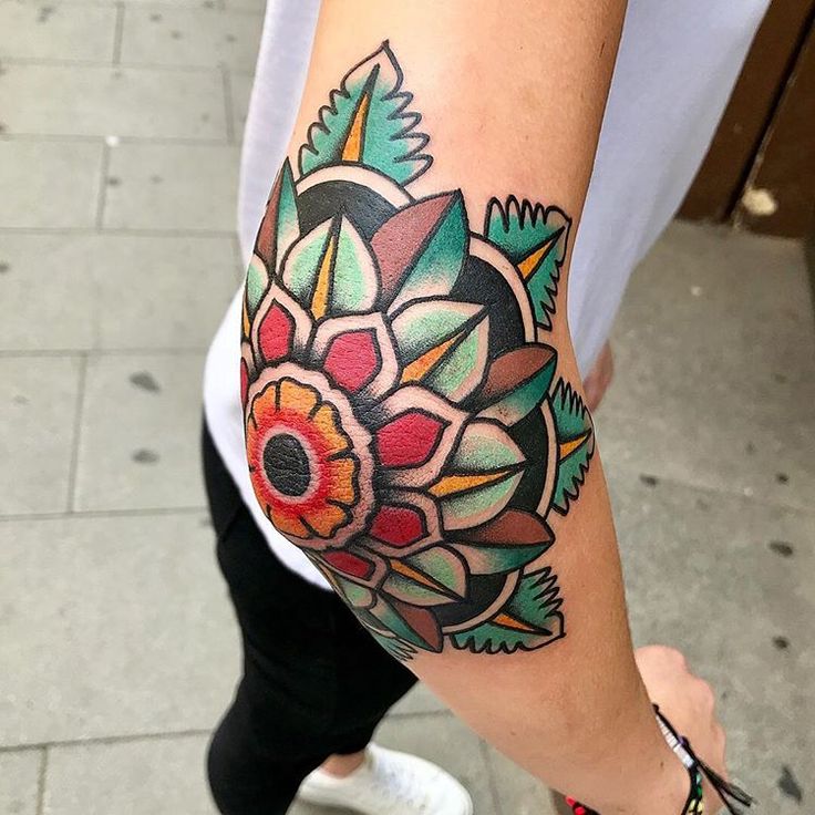 a person with a colorful tattoo on their arm