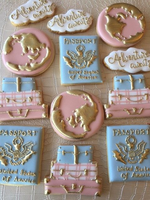 some cookies are decorated with pink and blue icing