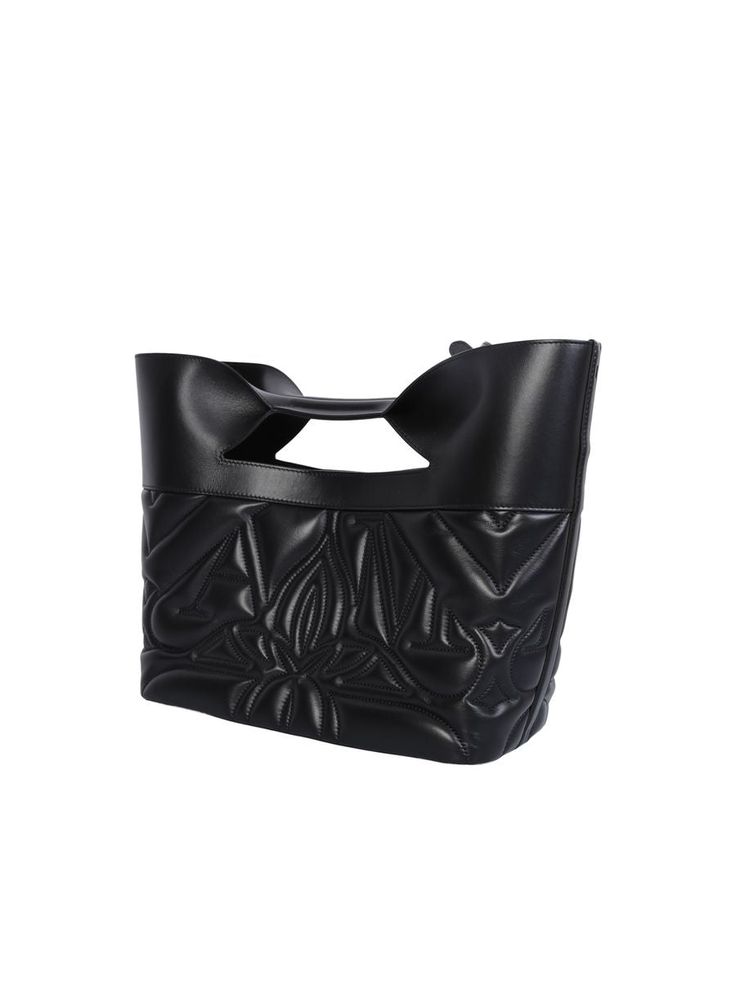 This Alexander McQueen bag boasts a structured silhouette defined by sharp linesQuilted. Embroidered logo on the front. Magnetic fastening. Main compartment. Adjustable detachable shoulder strap. Flat top handles. Color: blackWidth: 43 cm Height: 30 cm Depth: 14 cm Strap: 50 cmMaterial: 100% Calf LeatherMade in ItalyGender: WOMENMaterial: 100% CALF LEATHERColor: BLACKMade in: ITProduct ID: 709566 1BLFU 1000*Import tax/duty will be calculated at checkout (If applicable) Designer Black Structured Bag, Black Structured Bag With Top Carry Handle, Black Structured Shopping Bag, Black Luxury Structured Bag, Black Structured Bag For Shopping, Luxury Black Structured Bag, Structured Black Shopping Bag, Structured Black Bag For Shopping, Black Structured Bag With Removable Pouch