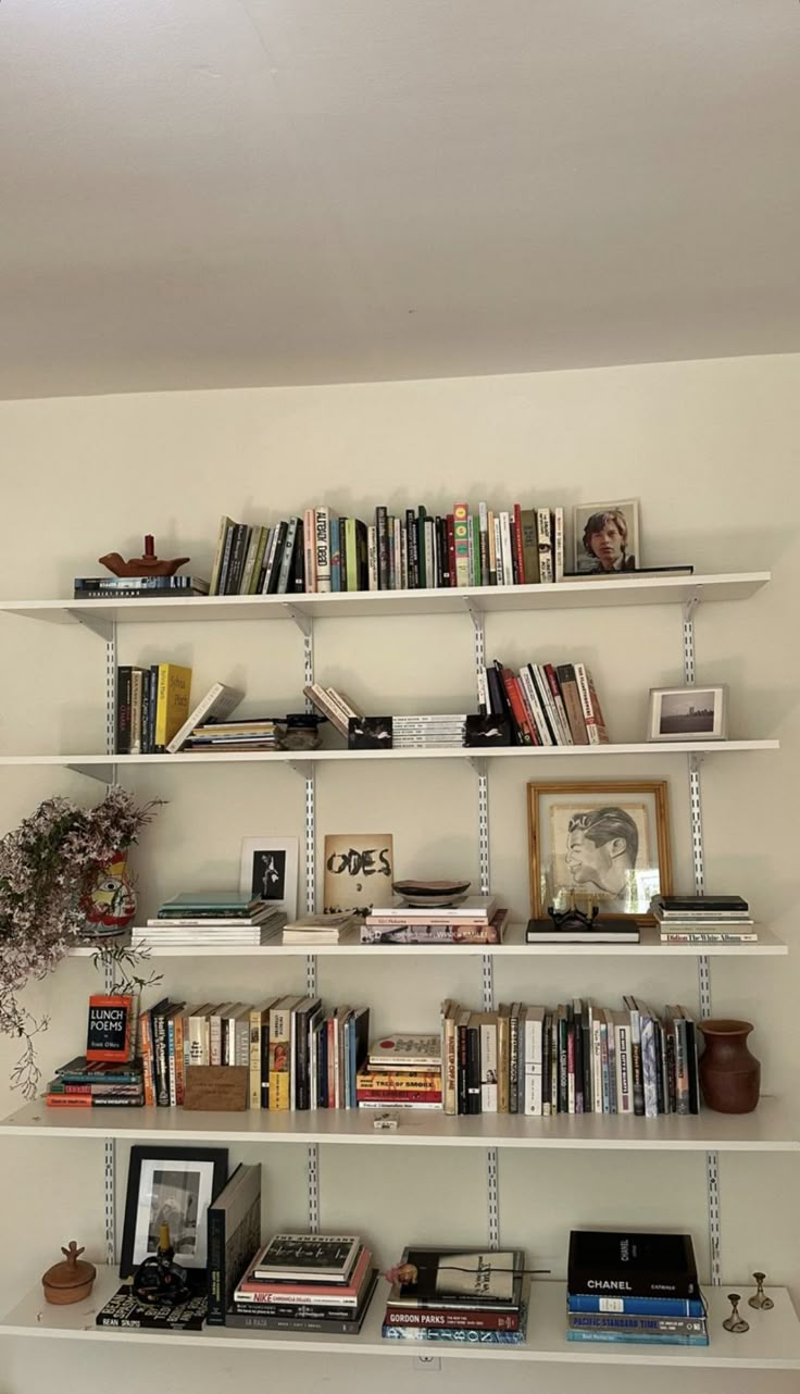 the bookshelves are filled with many different types of books