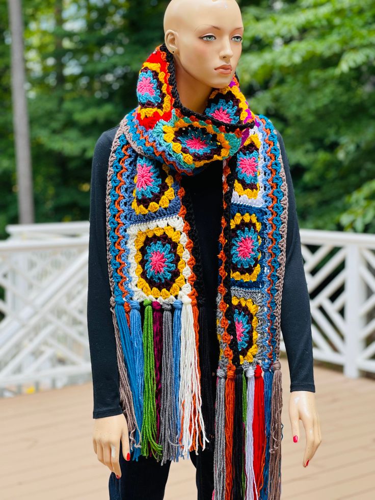 This is an over sized, super scarf made from soft acrylic yarn for HIM or HER. Unisex all year round wear. Measures over 110 long, and 8' wide. COLOR(s): Multicolored. MATERIAL: 100% Acrylic yarn CARE: Machine washable and dryable. RETURN/ REFUND POLICY: No Refunds or Returns. All items are final sale. VERY IMPORTANT: I'm NOT responsible for shipping delays once an item leaves my shop. A tracking number and phone number for the Postal Service is provided for you to track your item once shipped. Please do report damaged items within 24 hours of delivery so that I, can respond appropriately. NOTE: All items are handmade by me. If you should desire a color option not available in the shop, you can custom order one using the 'Custom Order' button on the main page, or just e-mail me. Allow 3-5 Bohemian Acrylic Yarn Shawl For Winter, One Size Acrylic Scarves For Fall, One Size Yarn Scarves For Cold Weather, Yarn Scarves For Cold Weather, Cold Weather Yarn Scarves, Acrylic Yarn Scarf For Cold Weather, Acrylic Shawl Scarves For Winter, Cold Weather Acrylic Yarn Scarves, Cold Weather Acrylic Yarn Scarf