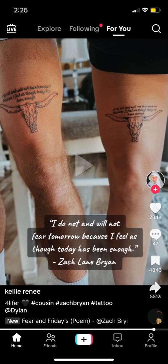 two people with tattoos on their legs and one is holding the other's leg