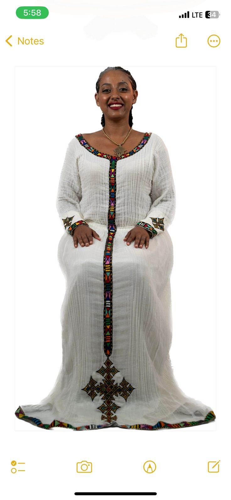 Simple Ethiopian dress with a beautiful trim and hand embroidery. This dress comes with full netela (two panel 2m scarf). Model is wearing a A/M but It can be custome made in any size. please send your measurements when you place your order and your phone number. phone numbers are required on the shipping form. Traditional Maxi Dress With Embroidered Neckline, White Embroidered Maxi Dress For Traditional Ceremonies, Elegant Dresses With Embroidered Border For Traditional Ceremonies, Fitted Wedding Dress With Embroidered Border, Fitted Maxi Dress With Embroidered Border, Elegant Fitted Dress With Embroidered Border, Fitted Long Sleeve Dress With Embroidered Border, Traditional Maxi Dress With Embroidered Sleeves, Long Dresses With Floral Embroidery For Traditional Ceremonies