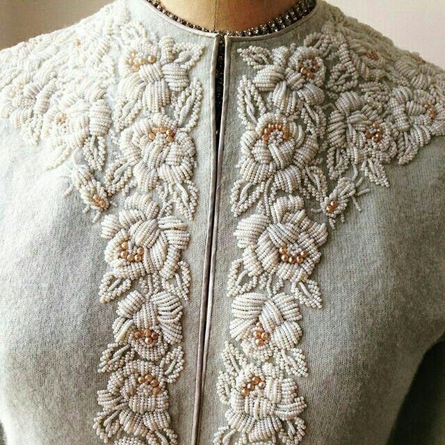 a close up of a dress on a mannequin headdress with beading