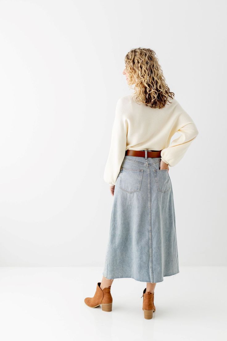 With a high waist, classic wash, and a raw edge hem, the 'Brooke' A-Line Denim Skirt is bound to become a favorite in your denim collection! It is a true high waisted skirt designed to be worn high at the smallest part of the waist while the hem flares out for a flattering fit. We love the lived in look of this no-stretch midi denim skirt! Wear it casual with white sneakers and a tee or pair it with a classic button down for a chic vintage style! 100% Cotton A-Line Fit No-Stretch Hand Wash Cold, Midi Denim Skirt, A Line Denim Skirt, Midi Denim, Denim Collection, Denim Midi Skirt, Chic Vintage, Skirt Design, Vintage Chic, White Sneakers