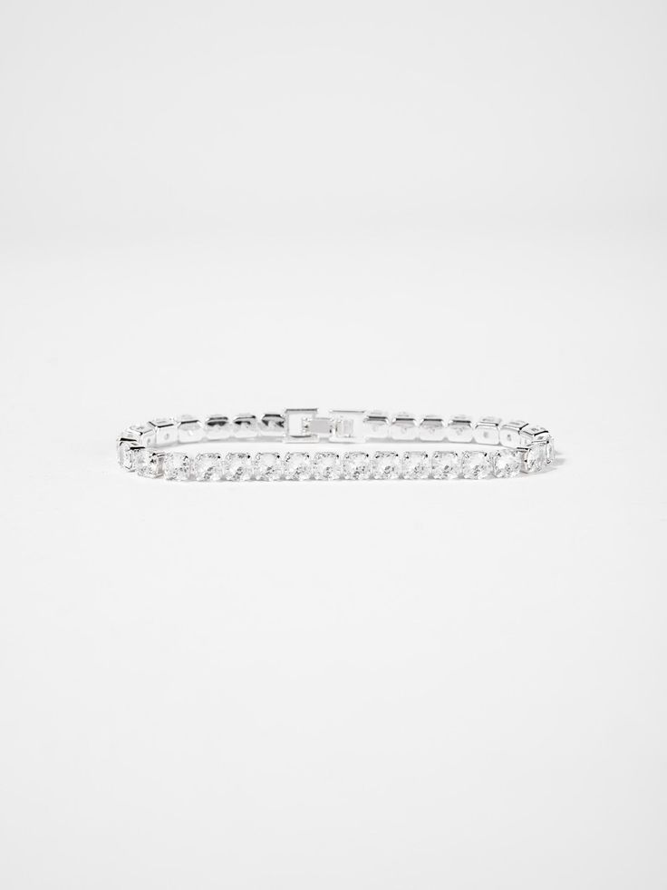 Discover the stunning Cecilia Cubic Zirconia Tennis Bracelet. Precision crafted with high-quality cubic zirconia stones, this bracelet radiates elegance and sophistication. Perfect for any special occasion, this timeless piece is guaranteed to make you stand out. Elevate your style with the Cecilia bracelet today. SizeL 7.25in QualityCrafted from premium materials for quality and endurance. ImportedBCZ9489 Elegant Cubic Zirconia Bracelet With Diamond Cut, Elegant Cubic Zirconia Crystal Bracelet With Diamond Cut, Elegant Diamond Cut Cubic Zirconia Crystal Bracelet, Elegant Sterling Silver Bracelet With Sparkling Cubic Zirconia, Elegant Sterling Silver Bracelet With Sparkling Stones, White Cubic Zirconia Diamond Bracelet For Party, Diamond Cut Crystal Bracelet In Diamond White, Diamond Cut Cubic Zirconia Crystal Bracelet, Diamond White Crystal Bracelet With Diamond Cut