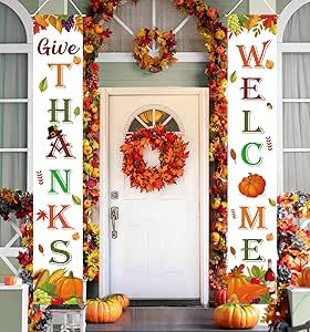 a front porch decorated for fall with pumpkins and other decorations