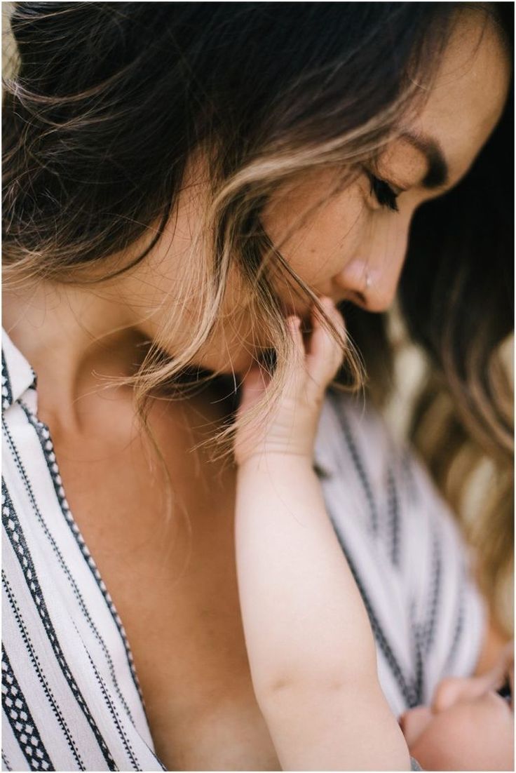 a woman holding a baby in her arms