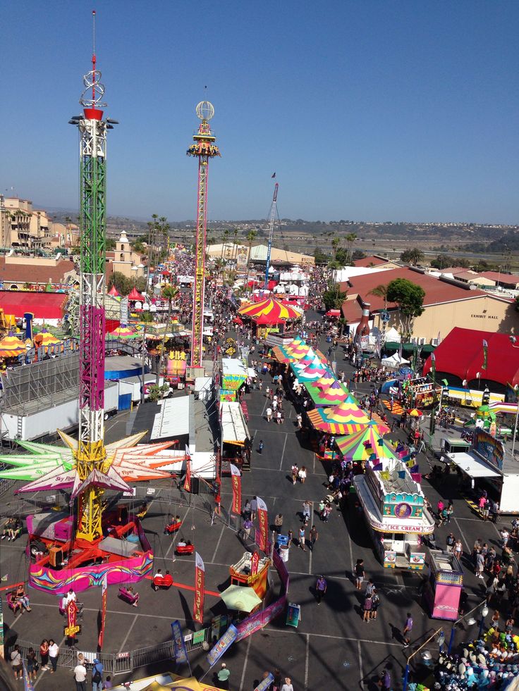 an aerial view of a carnival with many rides