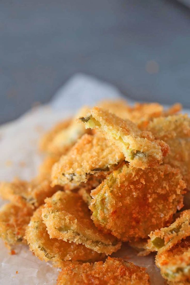 some fried food is sitting on a piece of parchment paper and it looks like something out of space