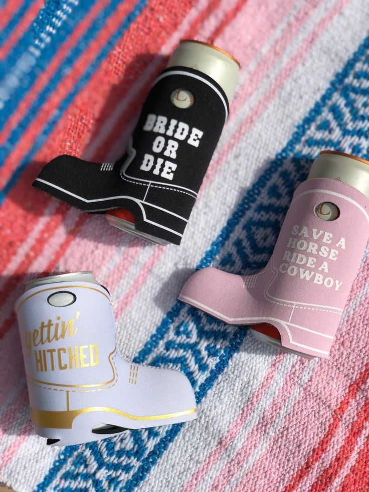 three different types of beer canisters sitting on a towel with the words ride or die printed on them