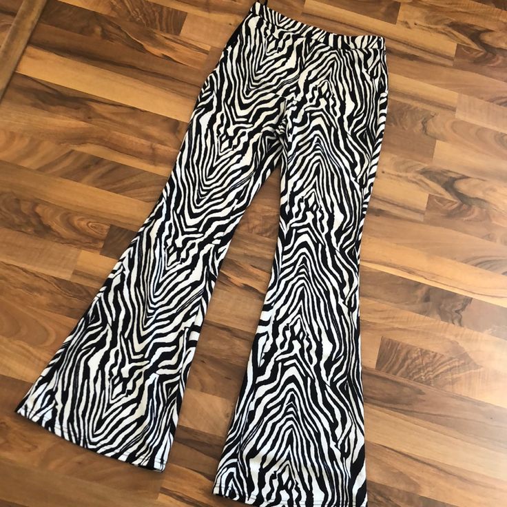 Never Worn Zebra Print Flare Pants. Zipper And Tie Waist. Stretch Zebra Print Bottoms For Summer, Black Zebra Print Pants For Spring, Casual Stretch Zebra Print Bottoms, Spring Black Zebra Print Pants, White Stretch Bottoms With Zebra Print, White Stretch Zebra Print Bottoms, White Zebra Print Stretch Bottoms, Casual Fitted Bottoms With Zebra Print, Casual Fitted Zebra Print Bottoms