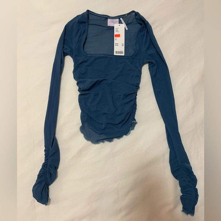 Size Xs, Cropped, Never Worn Blue Ruched Long Sleeve Top, Blue Long Sleeve Ruched Top, Casual Blue Ruched Top, Casual Light Blue Ruched Top, Blue Ruched Tops For Spring, Urban Outfitters Blue Long Sleeve Top, Blue Urban Outfitters Top For Fall, Urban Outfitters Blue Spring Tops, Blue Tops From Urban Outfitters For Spring