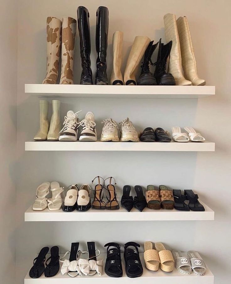 there are many pairs of shoes on the shelves