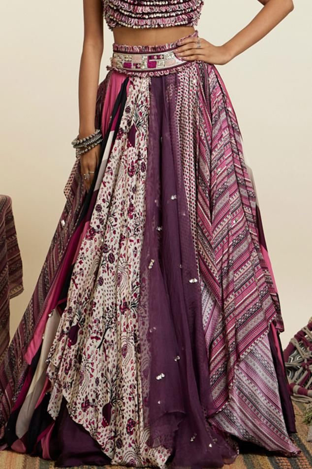 Purple flared layered lehenga with handkerchief hem and multi prints detail. Paired with sleeveless thread tassel embellished sleeveless blouse.
Components: 2
Pattern: Print, Embellished
Type Of Work: Rural Art 
Neckline: Square
Sleeve Type: Sleeveless
Fabric: Crepe
Color: Purple
Other Details: 
Note: The feather hair accessory worn by the model is not for sale
Occasion: Sangeet, Mehendi and Haldi - Aza Fashions Layered Lehenga, Lehenga With Blouse, Art Square, Feather Hair, Blouse For Women, Handkerchief Hem, Feathered Hairstyles, Blouse Online, Aza Fashion