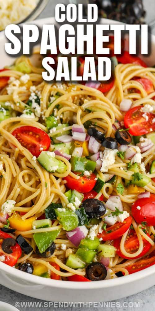 this cold spaghetti salad is loaded with fresh veggies, olives and feta cheese