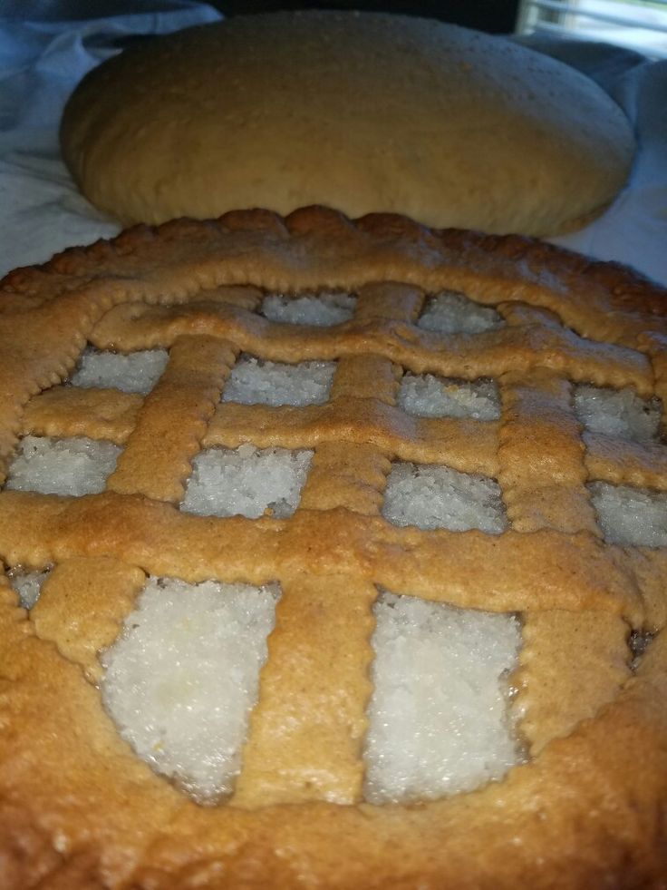 two large pastries sitting next to each other on top of a white table cloth