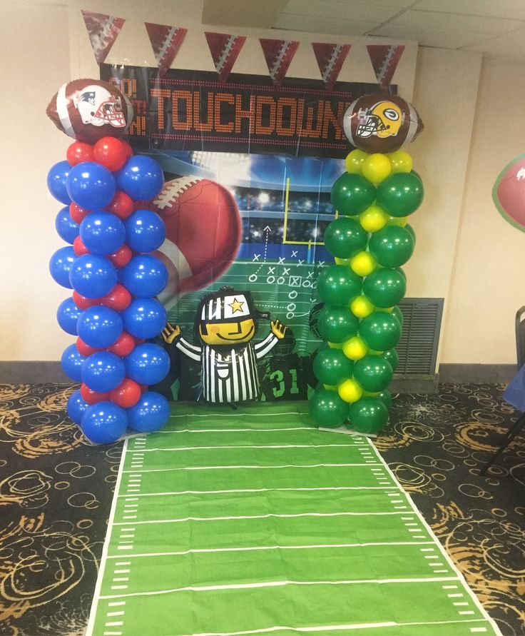 a football themed party with balloons and decorations