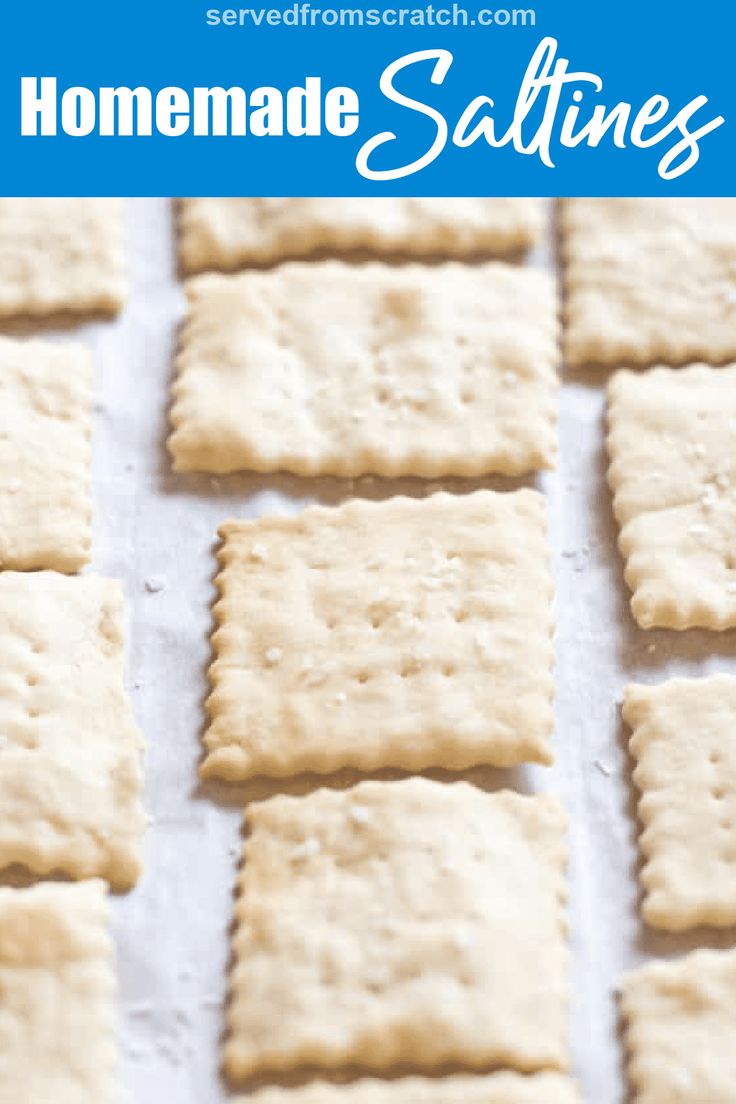 homemade saltine crackers on a baking sheet with text overlay that reads homemade saltines