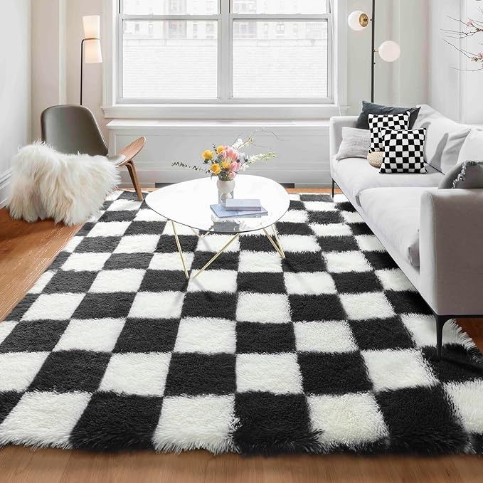 a black and white checkered rug in a living room