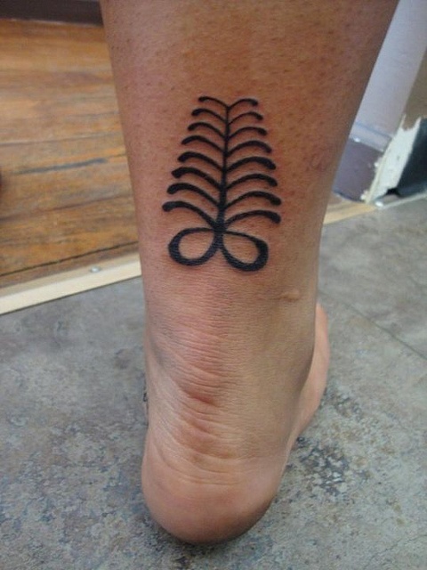 a person with a tattoo on their foot