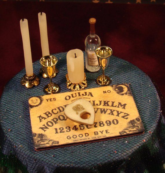 a table topped with candles and an old sign