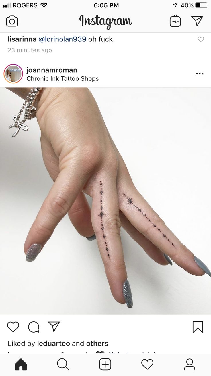 someone has their fingers tattooed with the words instagram on them and an arrow in the middle