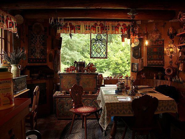 an old fashioned dining room with lots of furniture