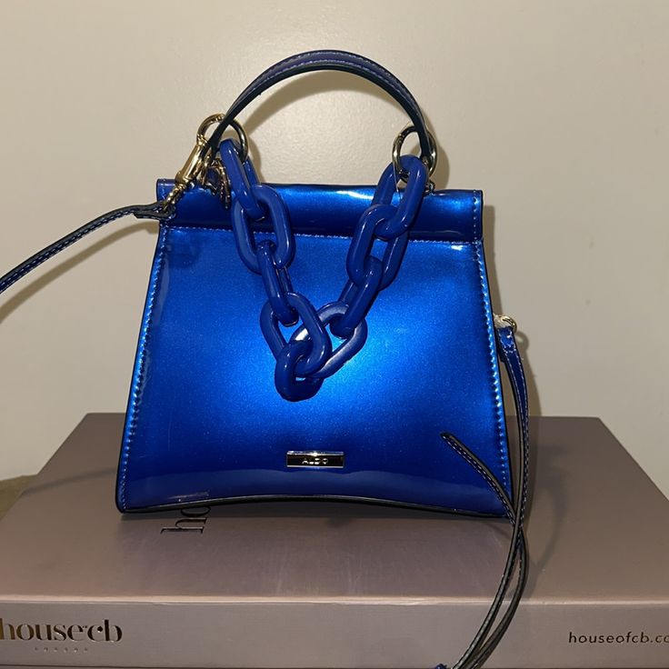 Ererrabaenn Aldo Bag New With Tags! ** Bottom Width: 8 1/4 In ** Depth: 3 In ** Height: 6 In ** Strap Length: 50 In ** Strap Drop: 25 In ** Handle Length: 7 In ** Handle Drop: 3 7/13 In Elegant Blue Shoulder Bag With Fold Over Clasp, Blue Evening Shoulder Bag With Adjustable Strap, Blue Shoulder Bag With Adjustable Strap For Evening, Evening Blue Shoulder Bag With Adjustable Strap, Blue Double Handle Shoulder Bag For Party, Blue Shoulder Bag With Adjustable Strap For Party, Formal Blue Bag With Chain Strap, Formal Blue Shoulder Bag With Chain Strap, Blue Party Shoulder Bag With Double Handle