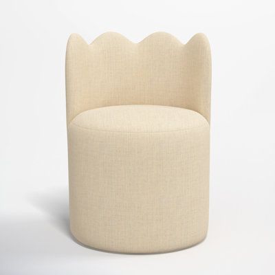 a round chair with scalloped backrests on a plain white background in the shape of a shell