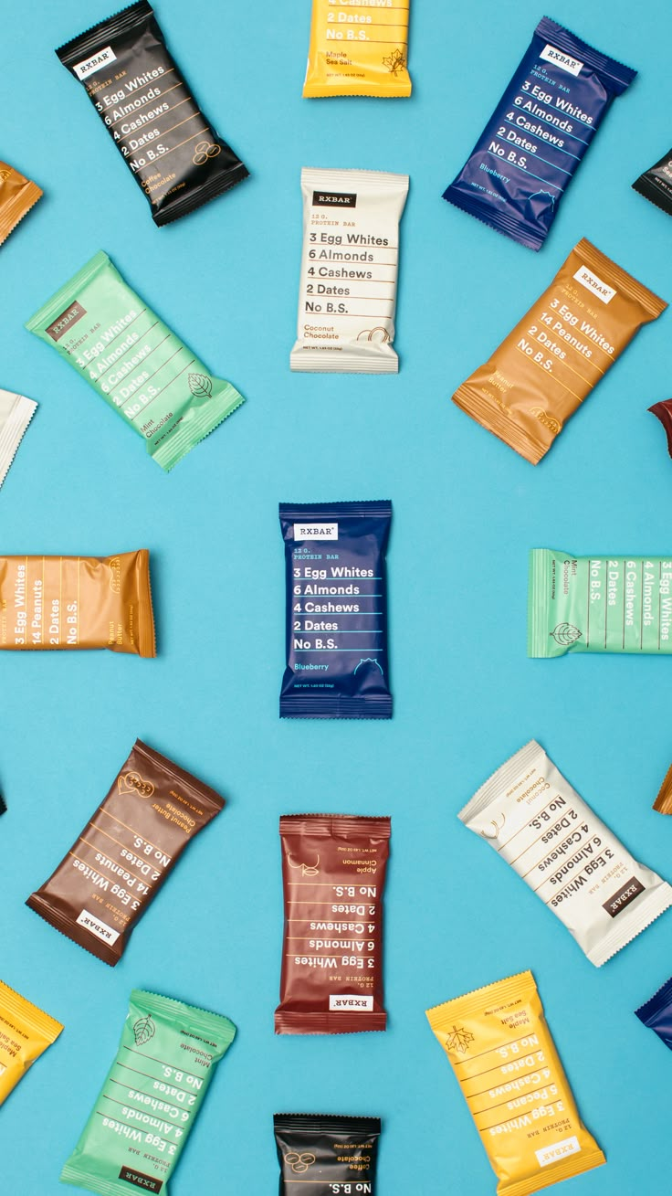 several different types of snacks laid out on a blue surface