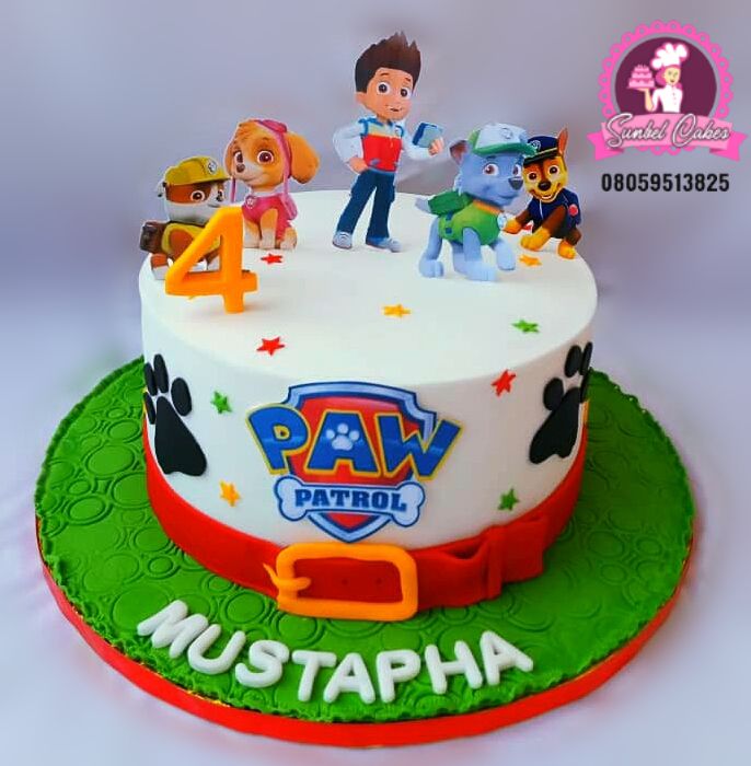 the birthday cake is decorated with paw patrol characters