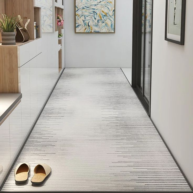 a pair of shoes sitting on the floor in a hallway