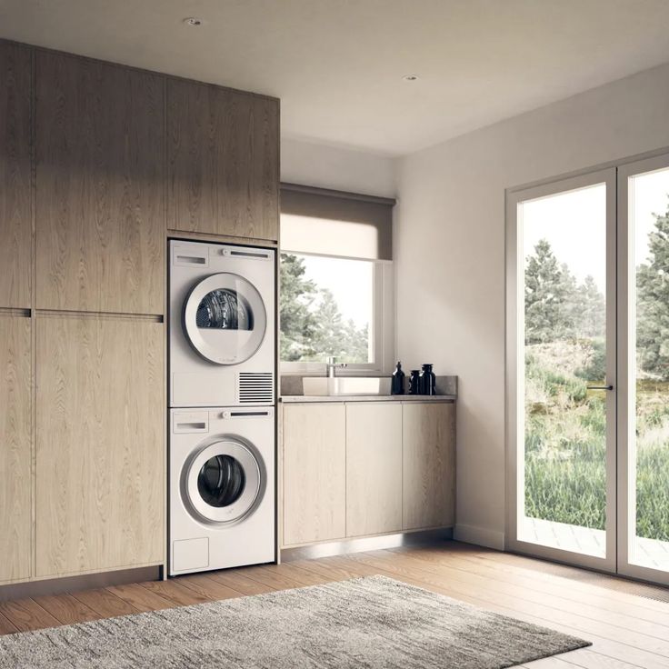 a washer and dryer in a room with wood flooring on the walls