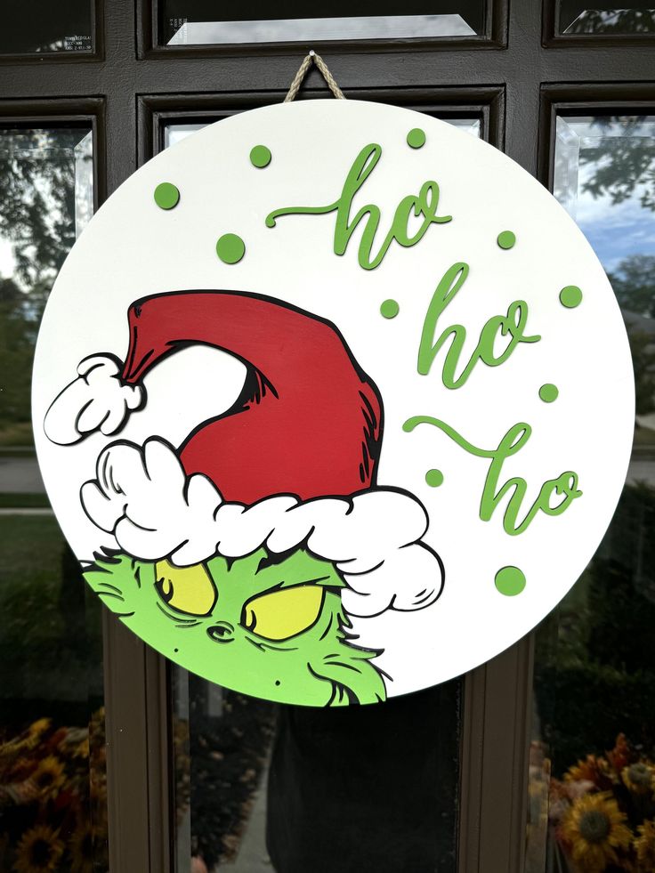 a sign that says, ho ho ho on the front of a door with an image of dr seuss