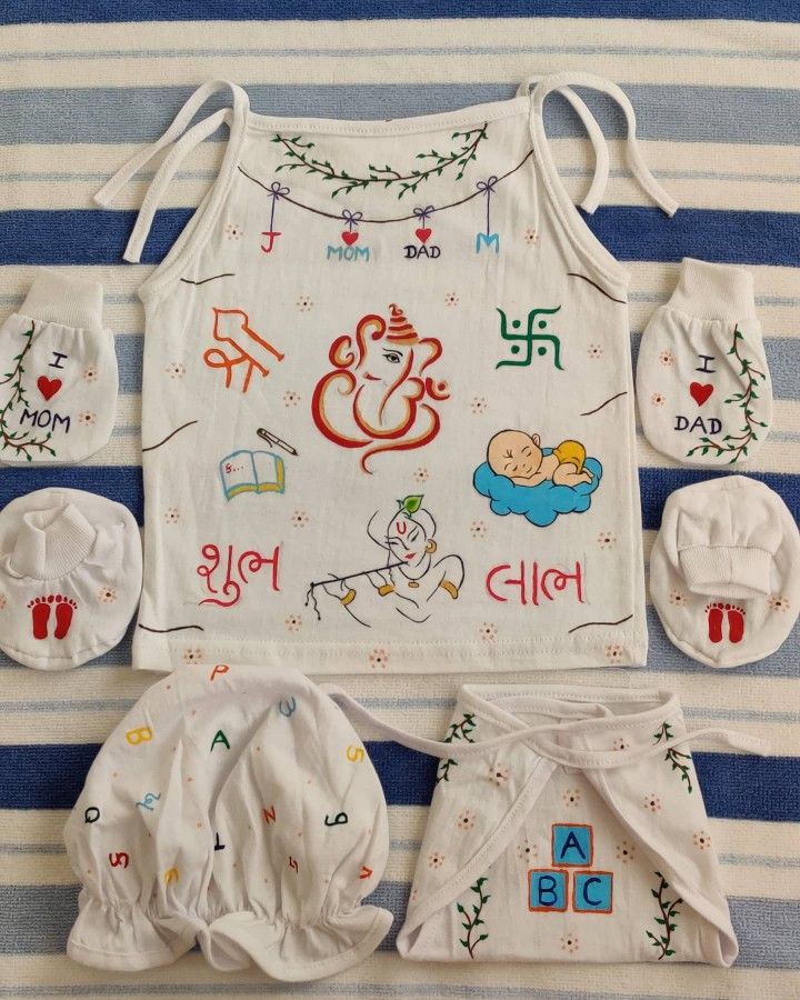 the baby's clothing is laid out and ready to be sewn on,