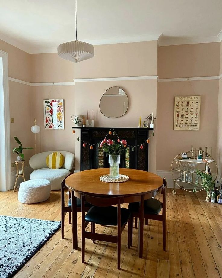 a living room filled with furniture and a fire place next to a fireplace on top of a hard wood floor