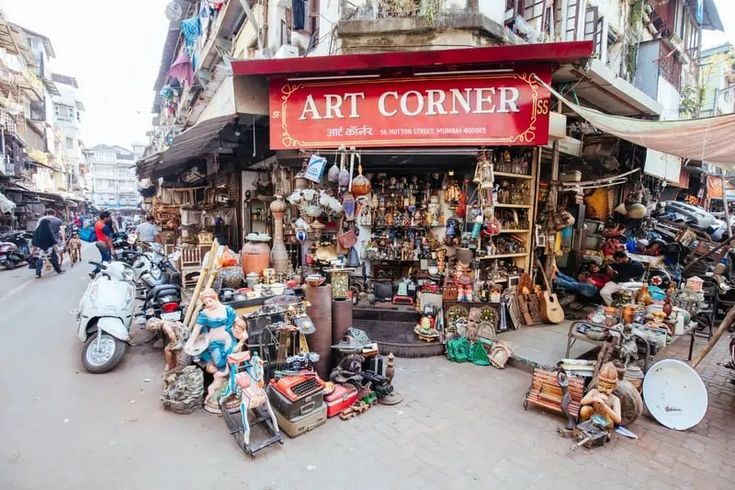 an outdoor market with lots of items on display