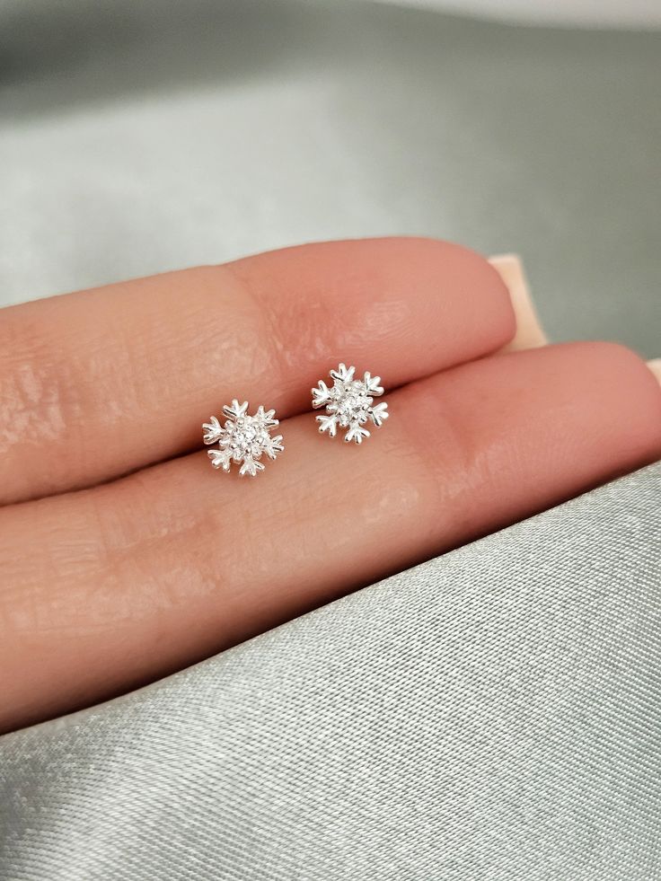 Welcome winter with these beautiful sterling silver tiny snowflake earring studs! The minimalist design is perfect to adorn your ears and keep you feeling festive all season long. Crafted with hypoallergenic sterling silver, these gorgeous earrings are sure to be a welcome addition to any winter wardrobe. They are both light and comfortable, so you can go about your days without feeling weighed down. These earrings are the perfect accessory for the winter season and make a thoughtful gift for th Tiny Snowflake, Silver Earrings Aesthetic, Swarovski Snowflake, Earrings For Kids, Silver Butterfly Earrings, Butterfly Earring, Winter Earrings, Earrings Aesthetic, Winter Jewelry