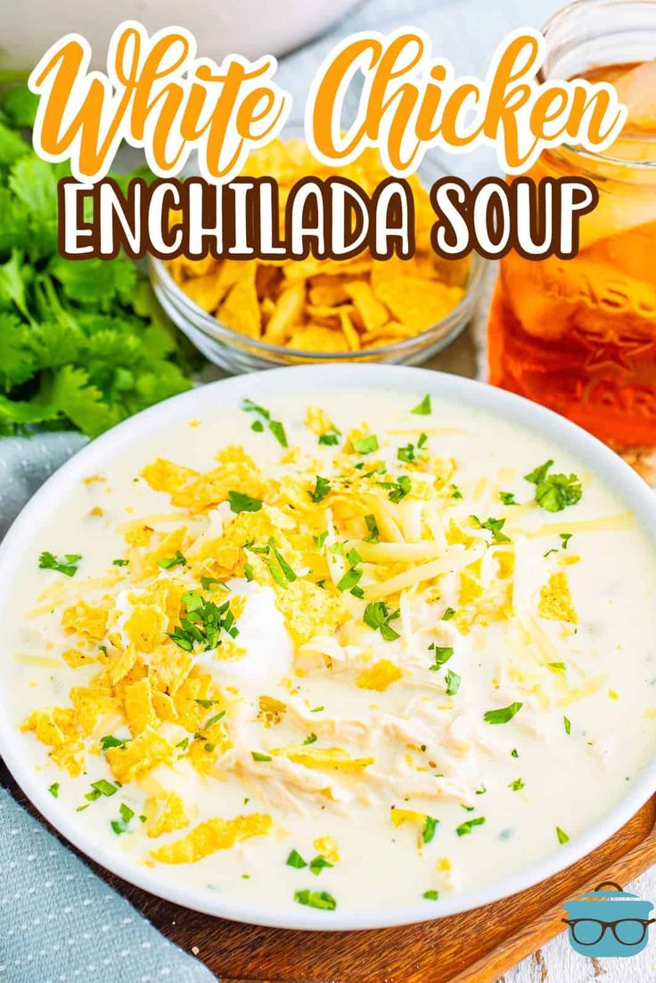 white chicken enchilada soup in a bowl with cilantro and parsley