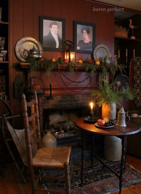 a living room filled with furniture and a fire place next to a mantle covered in pictures